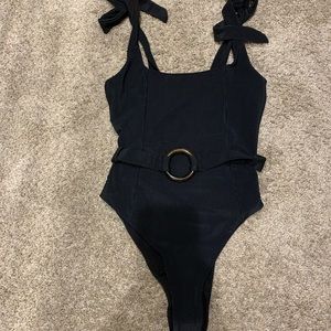Unworn! New without tags, still has liner! Beach riot one piece